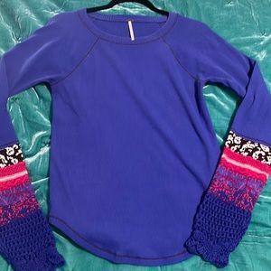 Free People thermal with intricate details crocheted on long sleeves.